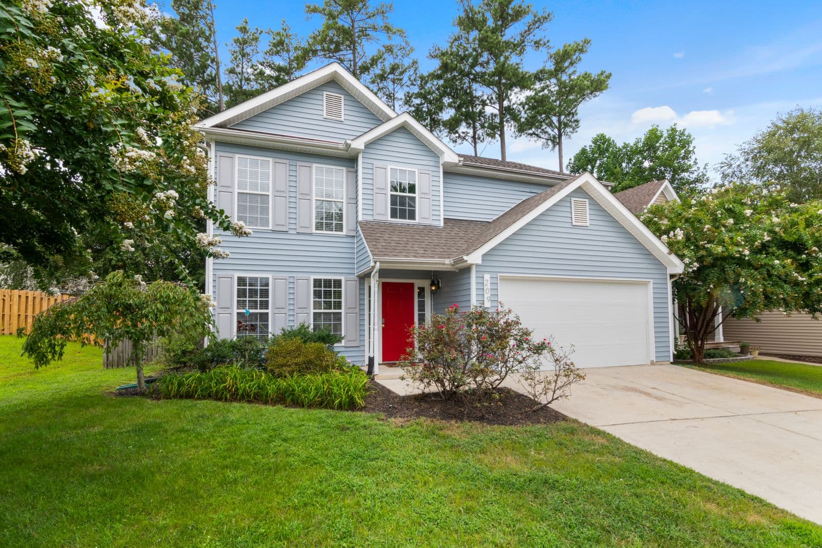 A classic blue traditional family home